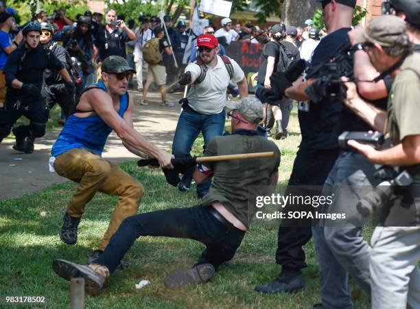 Member of the white supremacist and a protester are seen fighting. White supremacists gathered at Emancipation Park in Charlottesville, Virginia for...