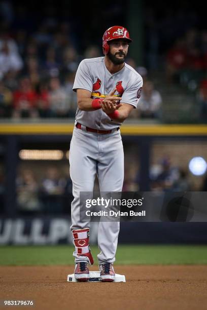 Matt Carpenter of the St. Louis Cardinals celebrates after hitting a double in the first inning against the Milwaukee Brewers at Miller Park on June...
