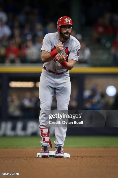 Matt Carpenter of the St. Louis Cardinals celebrates after hitting a double in the first inning against the Milwaukee Brewers at Miller Park on June...