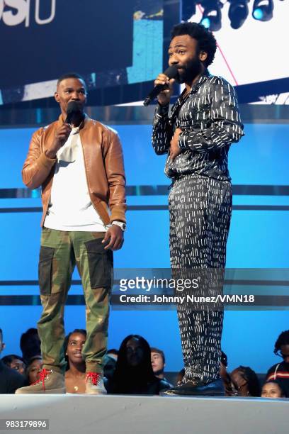 Host Jamie Foxx and Donald Glover speak onstage at the 2018 BET Awards at Microsoft Theater on June 24, 2018 in Los Angeles, California.