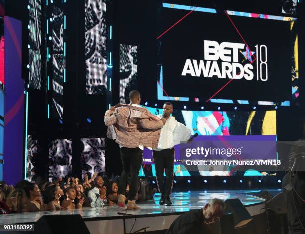 Michael B. Jordan and host Jamie Foxx speak onstage at the 2018 BET Awards at Microsoft Theater on June 24, 2018 in Los Angeles, California.