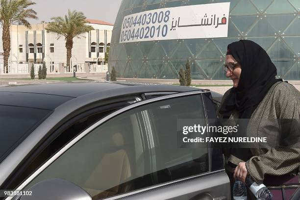 Saudi national and newly licensed Reem Farahat, an employee of Careem, a chauffeur car booking service, prepares for a customer shuttle using her car...