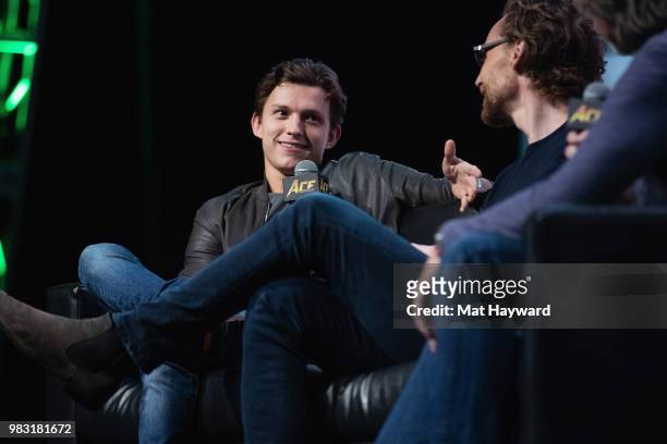 Tom Holland and Tom Hiddleston speak on stage during ACE Comic Con at WaMu Theatre on June 24, 2018 in Seattle, Washington.