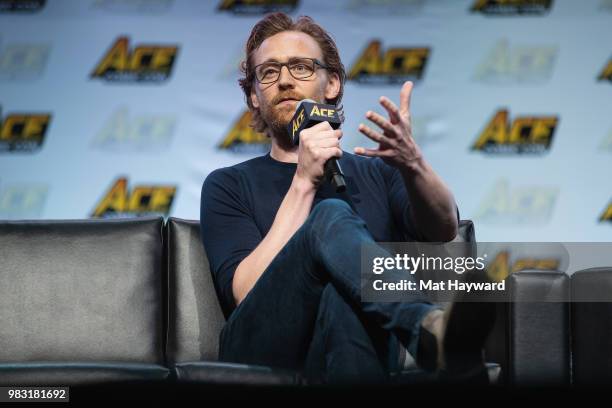 Actor Tom Hiddleston speaks on stage about life as Loki in the Marvel Universe during ACE Comic Con at WaMu Theatre on June 24, 2018 in Seattle,...