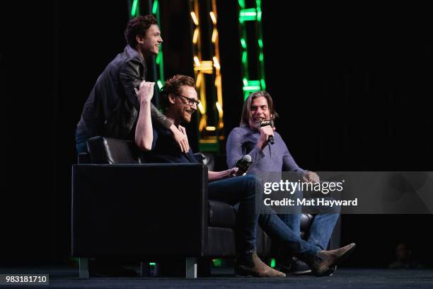 Tom Holland surprises Tom Hiddleston on stage during ACE Comic Con at WaMu Theatre on June 24, 2018 in Seattle, Washington.