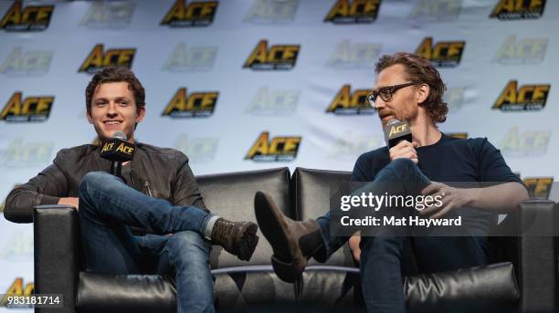 Tom Holland and Tom Hiddleston speak on stage during ACE Comic Con at WaMu Theatre on June 24, 2018 in Seattle, Washington.