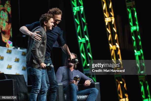 Tom Holland and Tom Hiddleston speak on stage during ACE Comic Con at WaMu Theatre on June 24, 2018 in Seattle, Washington.