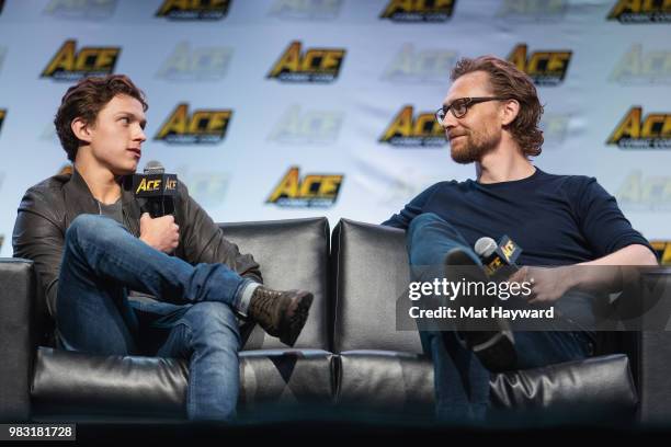 Tom Holland and Tom Hiddleston speak on stage during ACE Comic Con at WaMu Theatre on June 24, 2018 in Seattle, Washington.