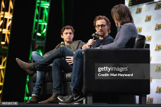 Tom Holland and Tom Hiddleston speak on stage during ACE Comic Con at WaMu Theatre on June 24, 2018 in Seattle, Washington.