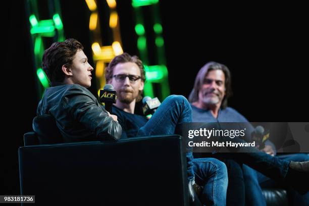 Tom Holland and Tom Hiddleston speak on stage during ACE Comic Con at WaMu Theatre on June 24, 2018 in Seattle, Washington.