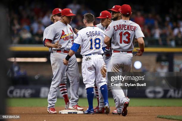 Yairo Munoz of the St. Louis Cardinals and Eric Sogard of the Milwaukee Brewers get into an argument in the eighth inning at Miller Park on June 22,...
