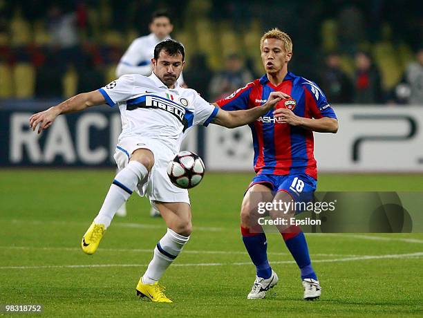 Keisuke Honda of CSKA Moscow battles for the ball with Dejan Stankovic of FC Internazionale Milano during the UEFA Champions League Quarter Finals,...