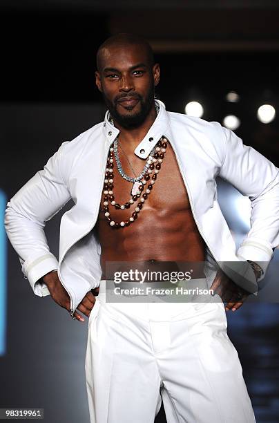 Tyson Beckford models on the runway at the fashion show for designer Chris Aire's "Hollywood Glamour Collection" at the Beverly Hills Hotel on April...