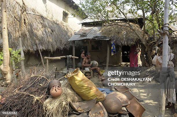 An Indian villager makes earthen pots at a village near Lalgarh, some 130 kms west of Kolkata, on April 5, 2010. Indian Home Minister P. Chidambaram...