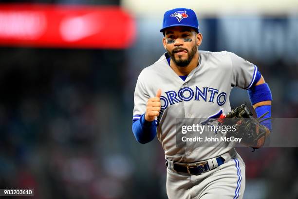 Devon Travis of the Toronto Blue Jays runs to the dugout at the end of the first inning against the Los Angeles Angels of Anaheim at Angel Stadium on...