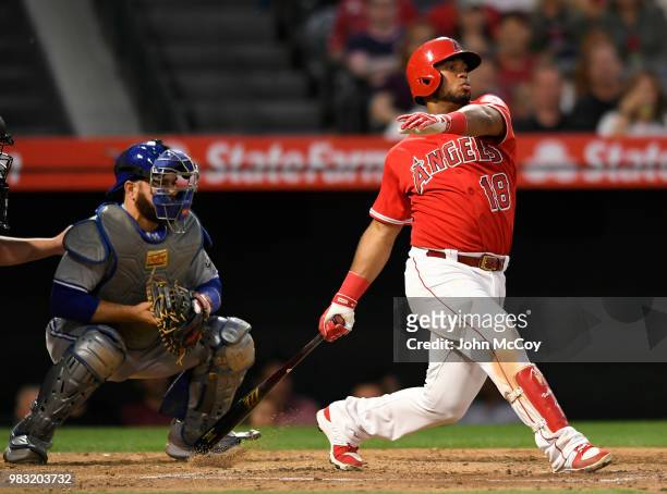 Russell Martin of the Toronto Blue Jays watches as Luis Valbuena of the Los Angeles Angels of Anaheim hits into a double play in the fifth inning at...