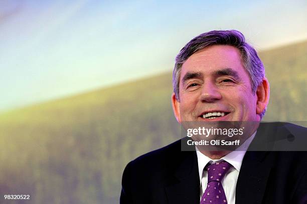 British Prime Minister Gordon Brown smiles during the Labour party's first press conference of the election campaign in Westminster on April 8, 2010...