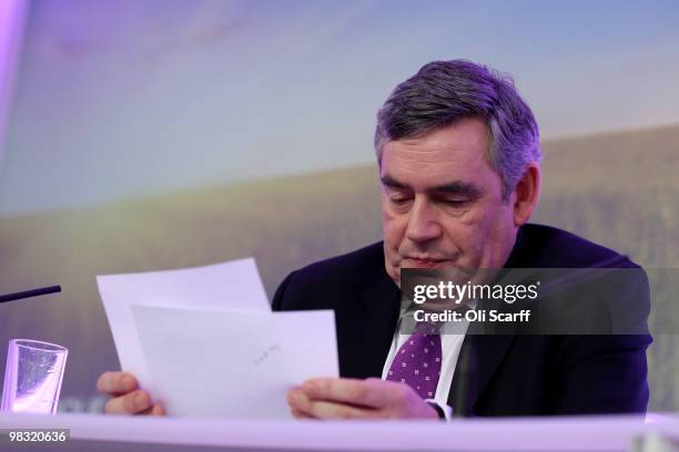 British Prime Minister Gordon Brown reads his notes during the Labour party's first press conference of the election campaign in Westminster on April...