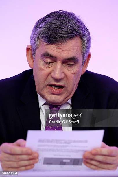 British Prime Minister Gordon Brown reads from his notes during the Labour party's first press conference of the election campaign in Westminster on...