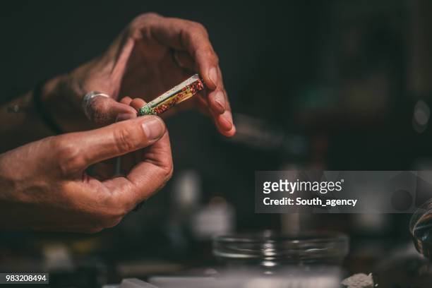 woman making beautiful jewelry in store - jasper mineral stock pictures, royalty-free photos & images