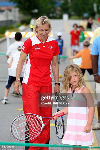 Tennis star Martina Navratilova and a member of the Boston Lobster teaches youth the game of Tennis on "Youth Day" before the WTT match against the...