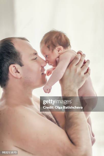 father holding baby (12-23 months) - genderblend2015 stock pictures, royalty-free photos & images