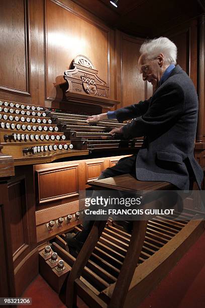 French composer, organist, pianist Jean Guillou plays the Saint-Eustache church's pipe organ, on March 24, 2010 in Paris. Since 1963 Guillou is the...