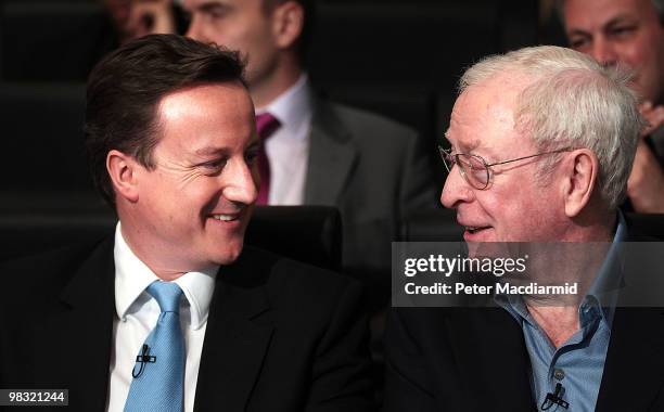 Conservative party leader David Cameron sits with actor Sir Michael Caine as he launches a 'National Citizens Service' on April 8, 2010 in London,...