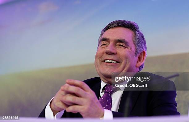 British Prime Minister Gordon Brown smiles during the Labour party's first press conference of the election campaign in Westminster on April 8, 2010...