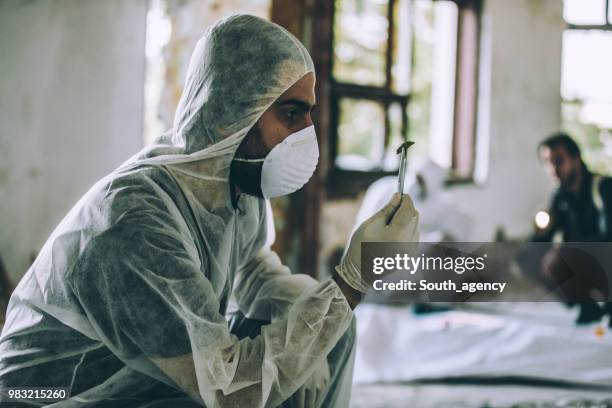 crime scene - white suit stock pictures, royalty-free photos & images