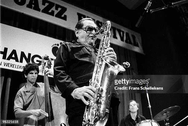 Tenor sax player Georgie Auld performs live on stage with Harry Emmery on bass and Eric Ineke on drums at Meervaart in Amsterdam, Netherlands on...