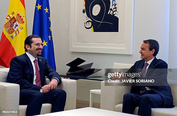 Spain's Prime Minister Jose Luis Rodriguez Zapatero chats with Lebanon's Prime Minister Saad Hariri during a meeting at Moncloa Palace in Madrid, on...