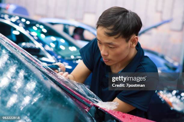 car pastes the membrane - man wrapped in plastic stock pictures, royalty-free photos & images