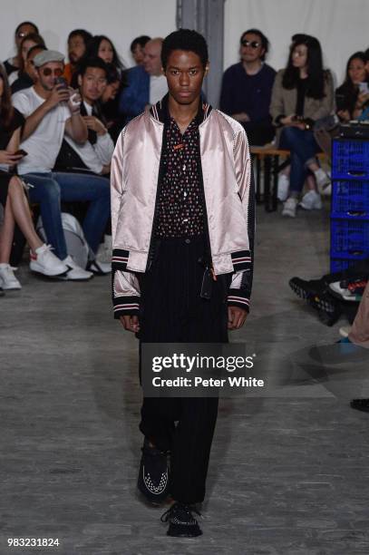 Model walks the runway during the Maison Mihara Yasuhiro Menswear Spring/Summer 2019 show as part of Paris Fashion Week on June 22, 2018 in Paris,...