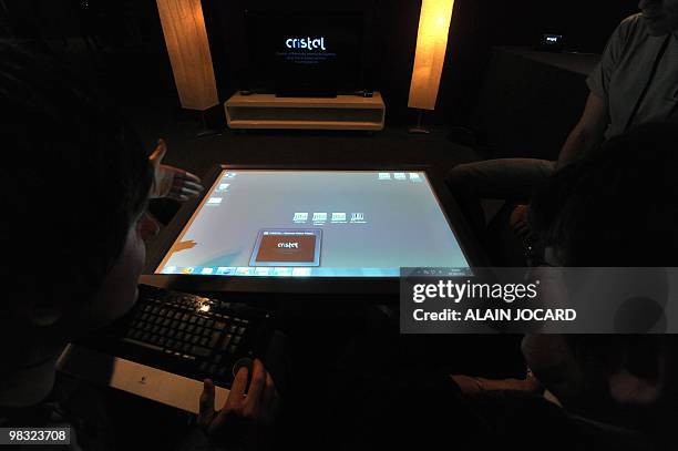 People present a table Cristal on April 7, 2010 in Laval, during the 12th edition of the Laval Virtual show dedicated to virtual technology. The...