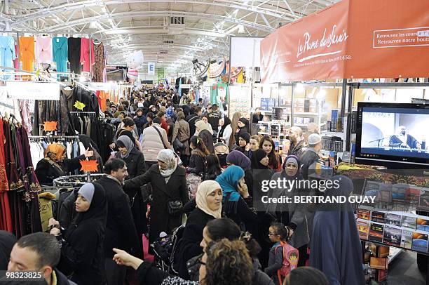 People attend the annual meeting of French Muslims organized by the Union of Islamic Organisations of France in Le Bourget, outside Paris, on April...