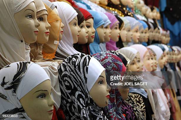 Veils are displayed on a women fashion stall of the annual meeting of French Muslims organized by the Union of Islamic Organisations of France in Le...