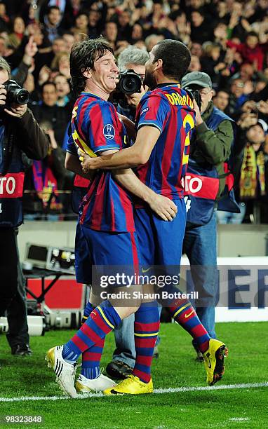 Lionel Messi of Barcelona celebrates scoring his second goal with Daniel Alves during the UEFA Champions League quarter final second leg match...