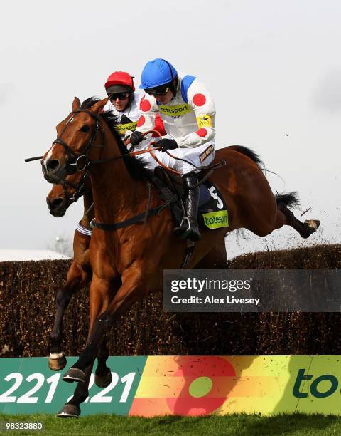 What A Friend ridden by Ruby Walsh clears the last fence ahead of Carruthers ridden by Mattie Batchelor to win The totesport Bowl Steeple Chase at...