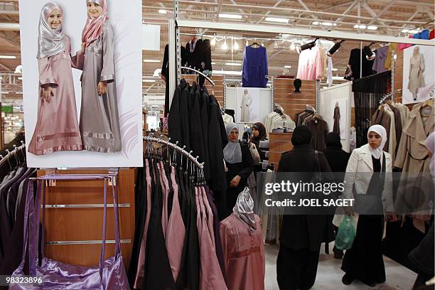 Women walk by women fashion stalls as they attend annual meeting of French Muslims organized by the Union of Islamic Organisations of France in Le...