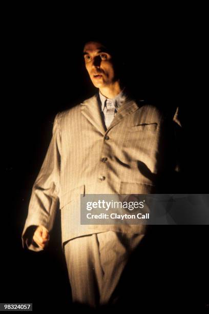 David Byrne performing with Talking Heads, wearing a large oversize suit, at the Greek Theater in Berkeley on September 4, 1983.