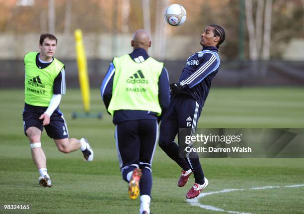 Florent Malouda and Branislav Ivanovic of Chelsea in action during a training session at the Cobham training ground on April 8, 2010 in Cobham,...