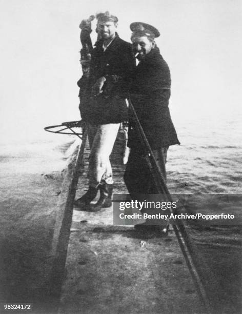 Lieutenant-Commander Guy D'Oyly-Hughes of the Royal Navy with his 3rd Officer on board their submarine in the Sea of Marmara, during the Dardanelles...