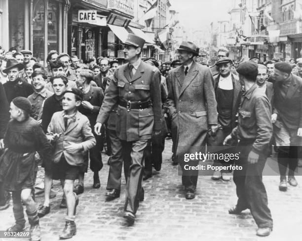 General Charles de Gaulle arrives in Paris to celebration the Liberation of the city during World War II, 26th August 1944.