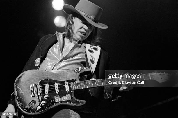 Stevie Ray Vaughan performing at the Warfield Theater in San Francisco on November 24, 1984. He plays a Fender Stratocaster guitar.