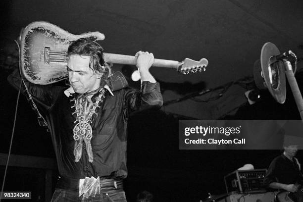 Stevie Ray Vaughan plays his guitar behind his head while performing at the Keystone Berkeley on August 19, 1983.