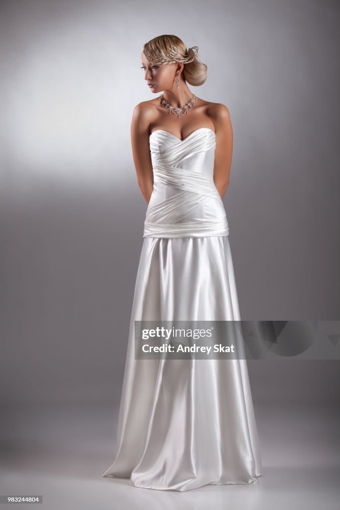 Young Beautiful Woman In A Wedding Dress