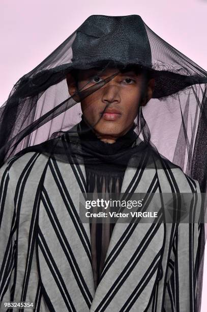 Model walks the runway during the Ann Demeulemeester Menswear Spring/Summer 2019 fashion show as part of Paris Fashion Week on June 22, 2018 in...