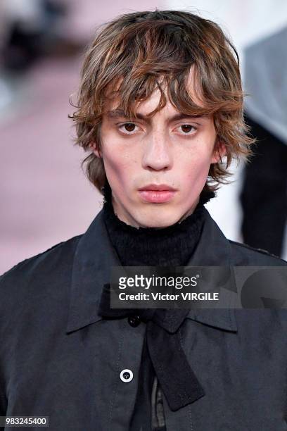 Model walks the runway during the Ann Demeulemeester Menswear Spring/Summer 2019 fashion show as part of Paris Fashion Week on June 22, 2018 in...