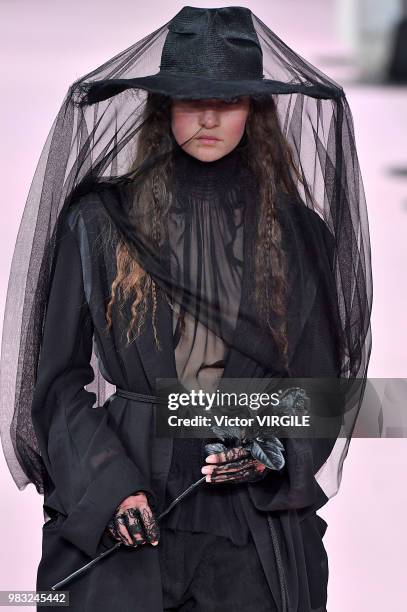 Model walks the runway during the Ann Demeulemeester Menswear Spring/Summer 2019 fashion show as part of Paris Fashion Week on June 22, 2018 in...